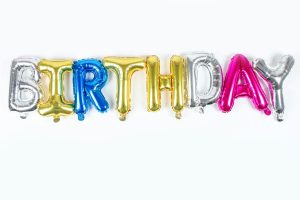 Vibrant metallic balloon letters spelling 'BIRTHDAY' for festive celebrations.